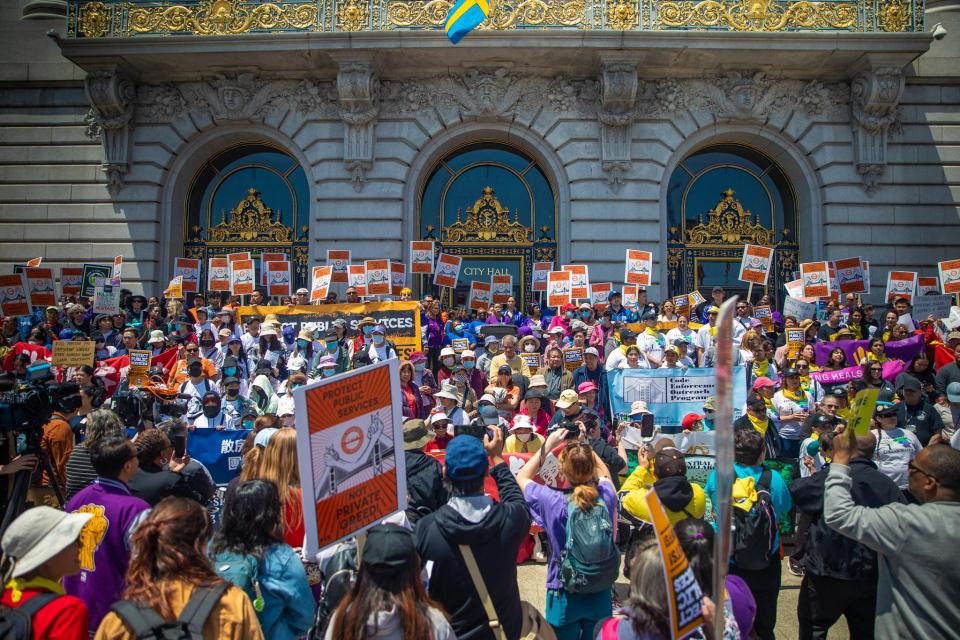 SF City workers and community organizations rally outside SF City Hall on June 4, 2025, to protest the mayor's proposed layoffs and service cuts