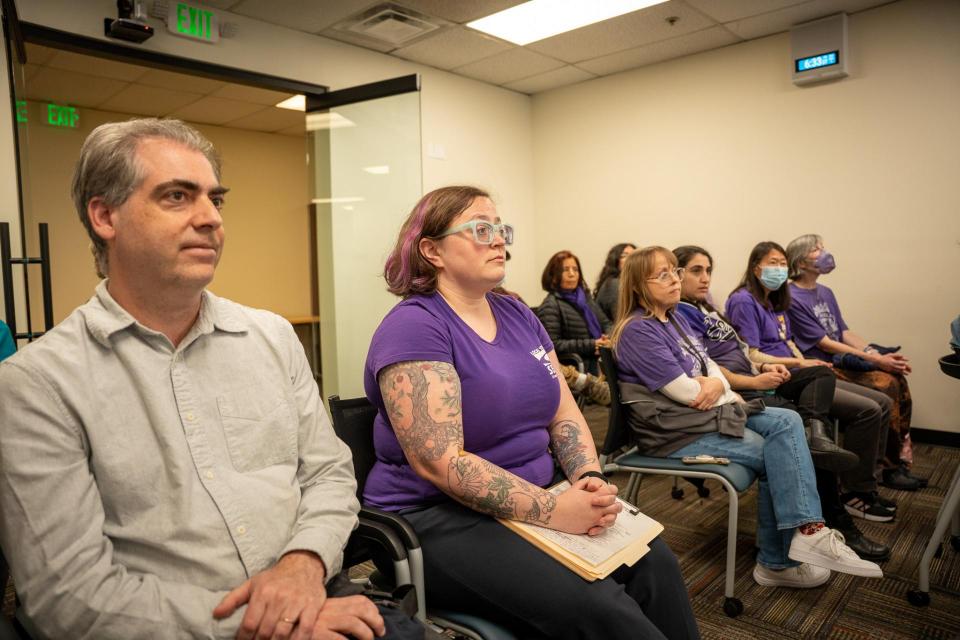 SEIU 1021-represented branch managers, librarians, and library support staff confronting the Library Commission over inadequate staffing