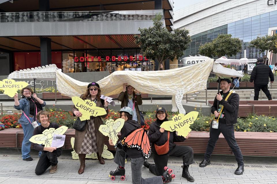 Cal Academy Workers United members of SEIU 1021 brought out a giant Claude the alligator puppet to flyer Valkyries fans outside the Chase Center on Monday, May 25.
