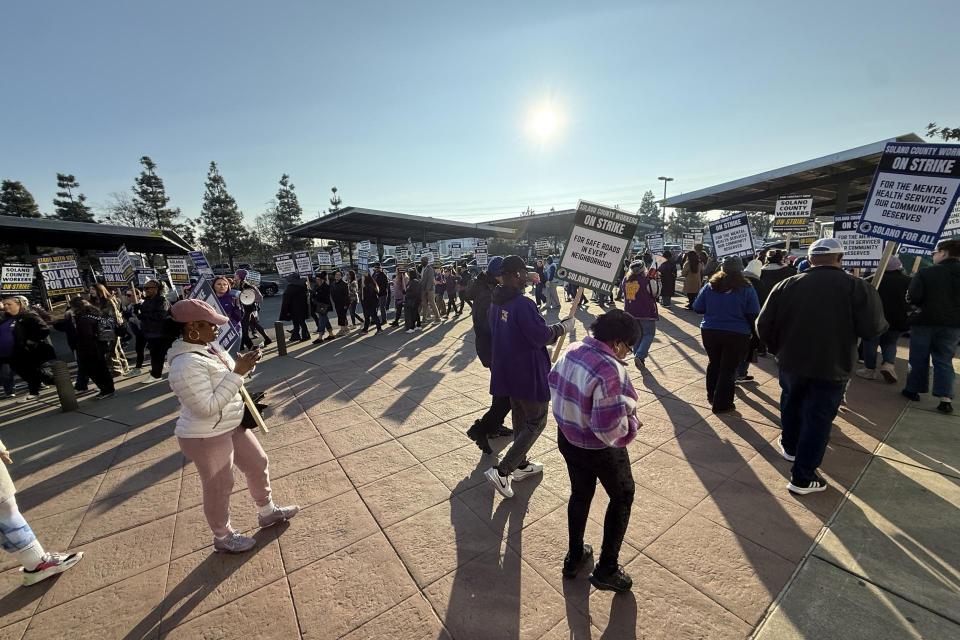 Solano County workers march on the strike line on the second day of the strike.
