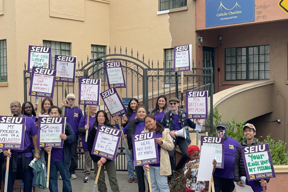 Catholic Charities workers rallied outside headquarters on Monday, July 21, protesting management's refusal to negotiate a fair contract even as they have pay for the nonprofit's top earners, including the CEO, by an average of 36%