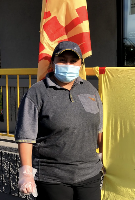 Maria Sabina stands in front of the McDonald's location she works at on Friday, January 15, 2021.